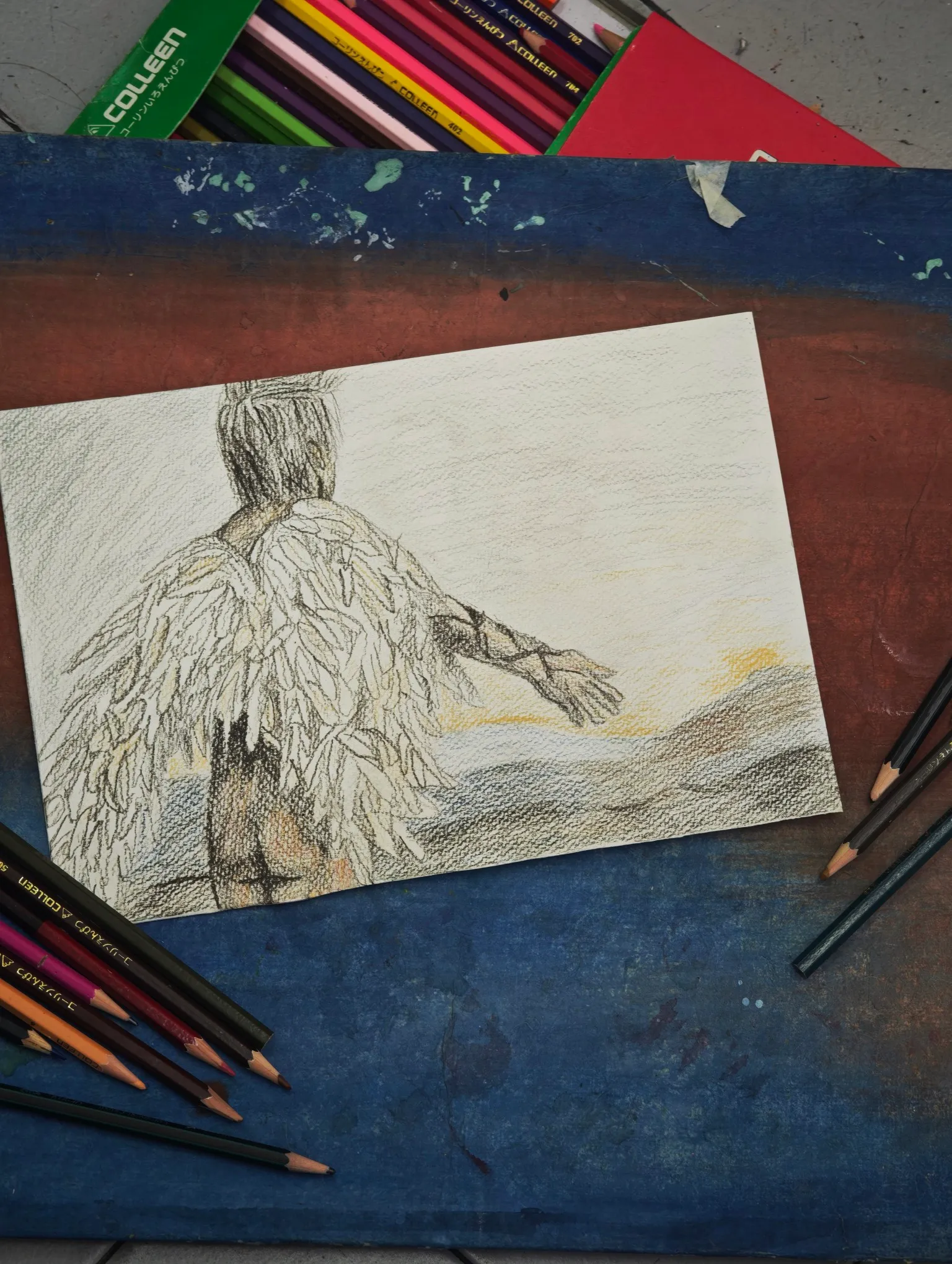 a winged bird standing over a city