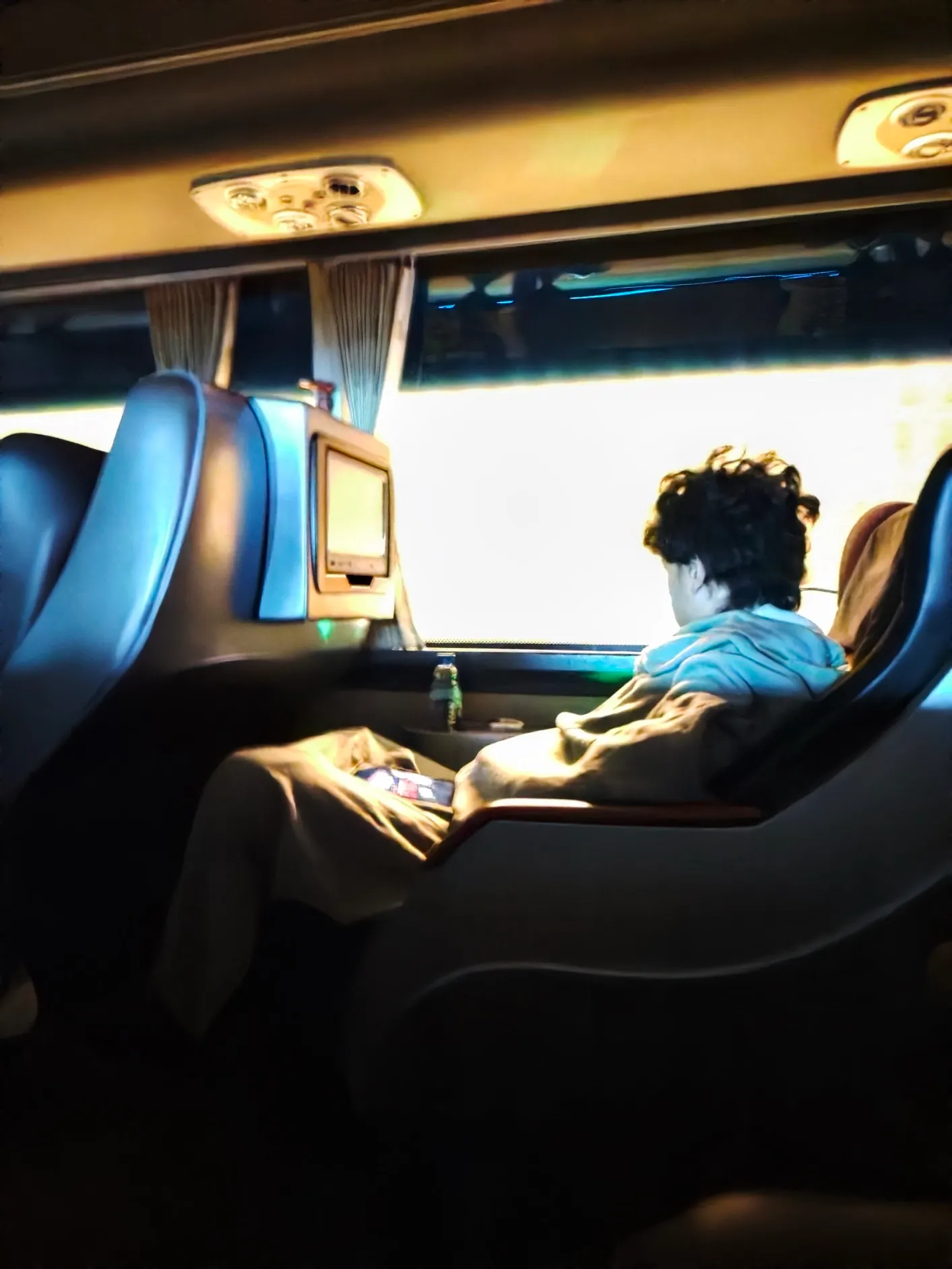 khun sitting in the seat opposite of me at the beginning of our ride to the north