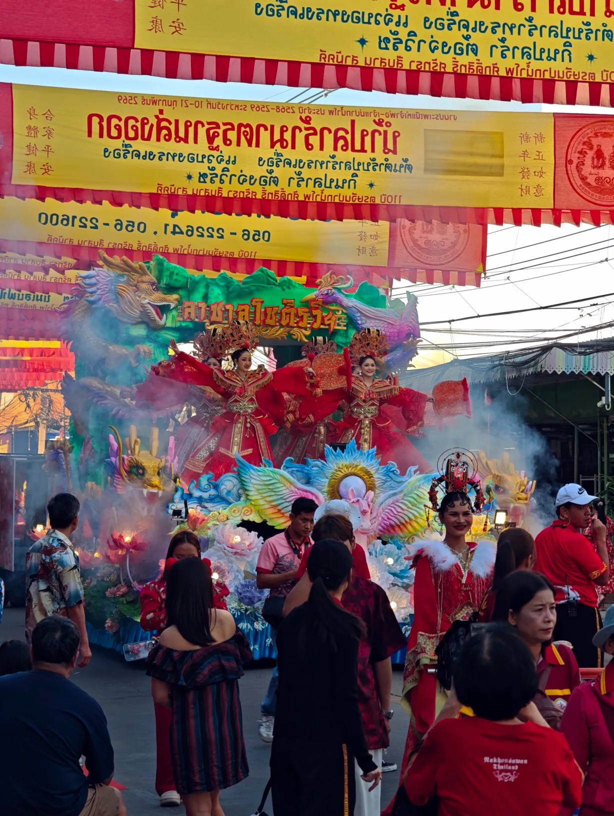 one of the parade floats. the smoke is from the firecrackers.