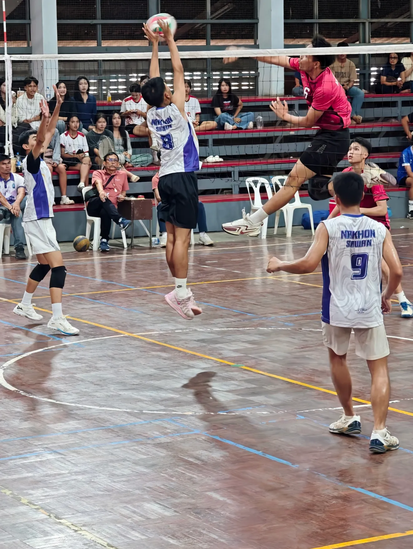 post blocked a spike at one of the volleyball matches at our school.