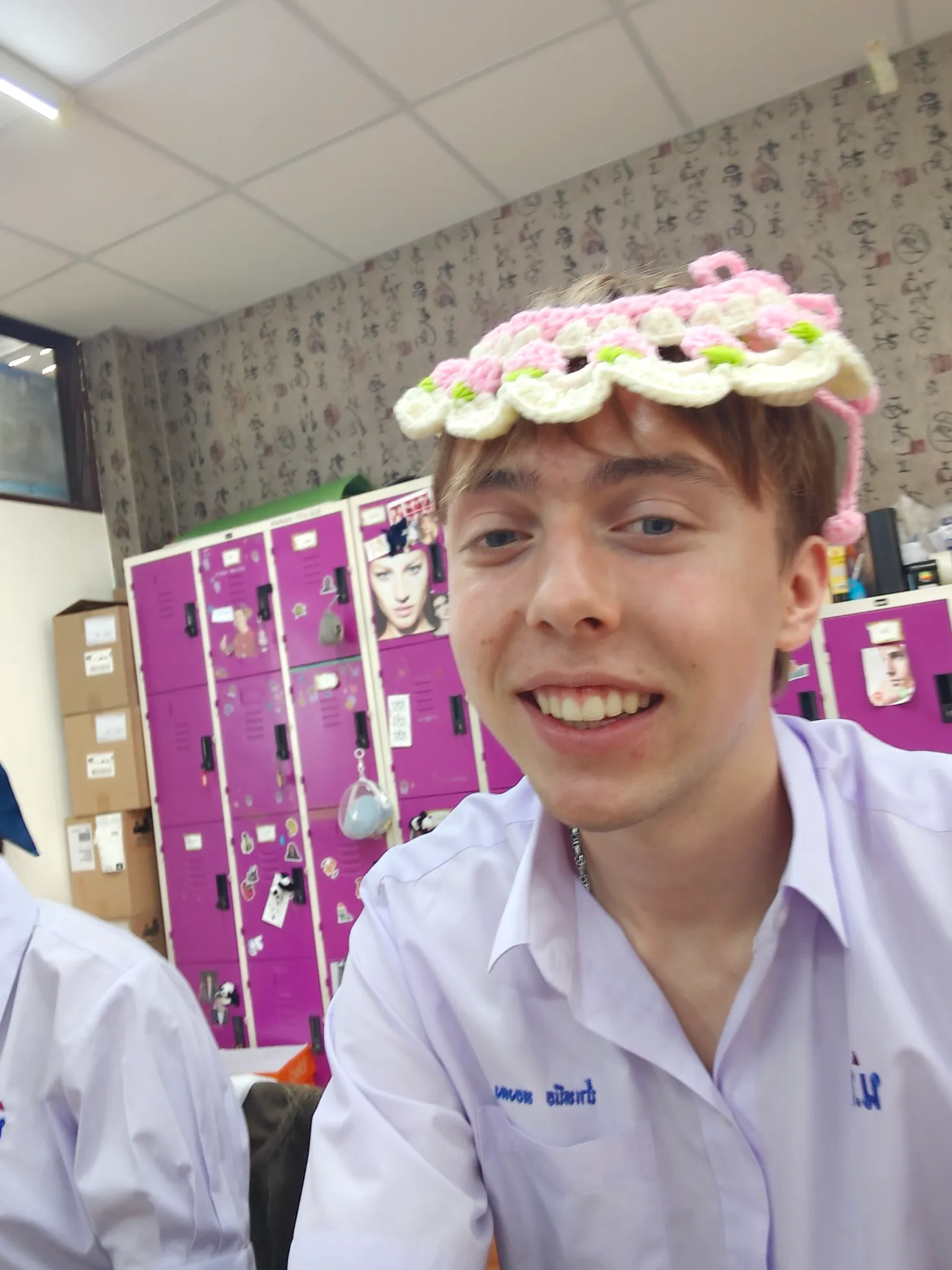 a picture of me wearing a silly hat that one of my friends corcheted in class